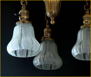 Title: Sheffield Style Shades, circa 1910 - Description: Detail shot of blue-green glass shades for brass Sheffield Light fixture.